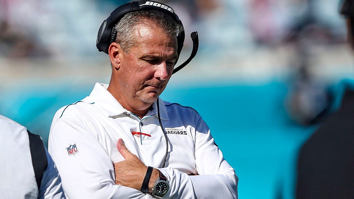 Former Jacksonville Jaguars head coach Urban Meyer stands on the sideline during a game against the Arizona Cardinals, Sunday, Sept. 26, 2021, in Jacksonville, Fla.