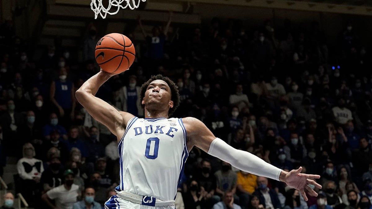 Duke forward Wendell Moore Jr. (0) drives for a dunk against Appalachian State during the first half of an NCAA college basketball game in Durham, N.C., Thursday, Dec. 16, 2021. 
