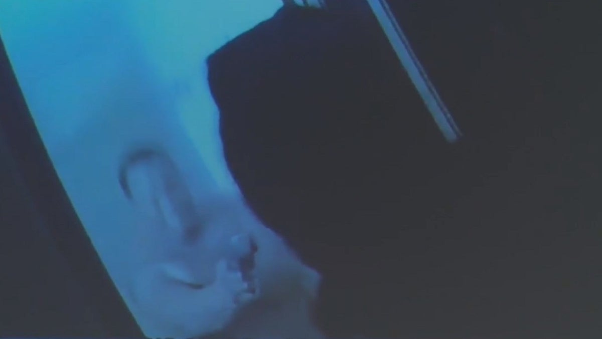 Authorities say photo shared by Wichita Police Department shows Malik Rogers pointing gun at officers on Dec. 25, 2021