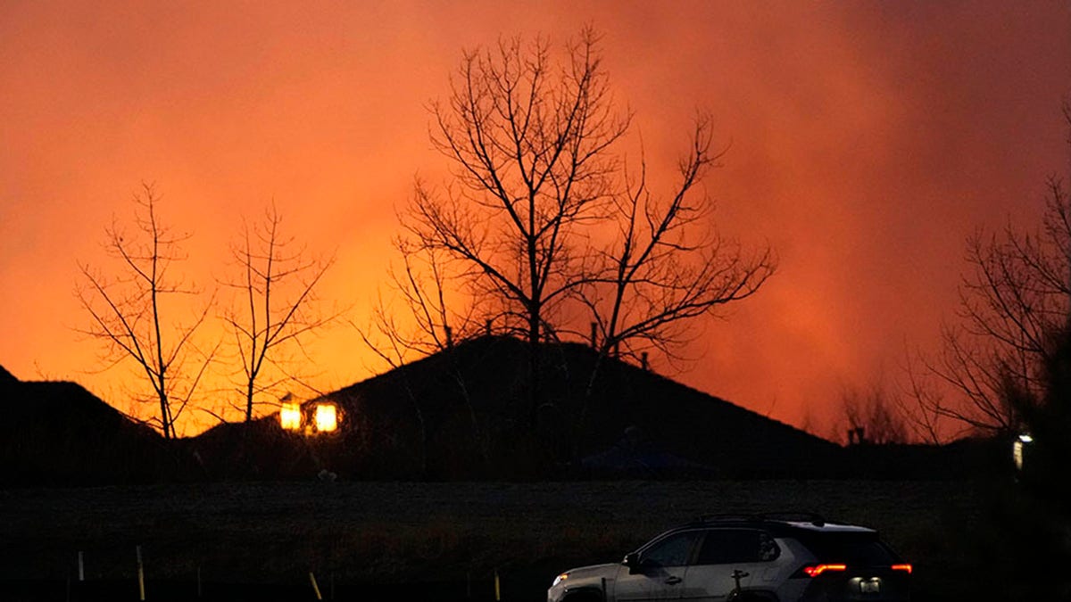 Flames explode as wildfires burned near a shopping center Thursday, Dec. 30, 2021, near Broomfield, Colo. Homes surrounding the Flatiron Crossing mall were being evacuated as wildfires raced through the grasslands as high winds raked the intermountain West.