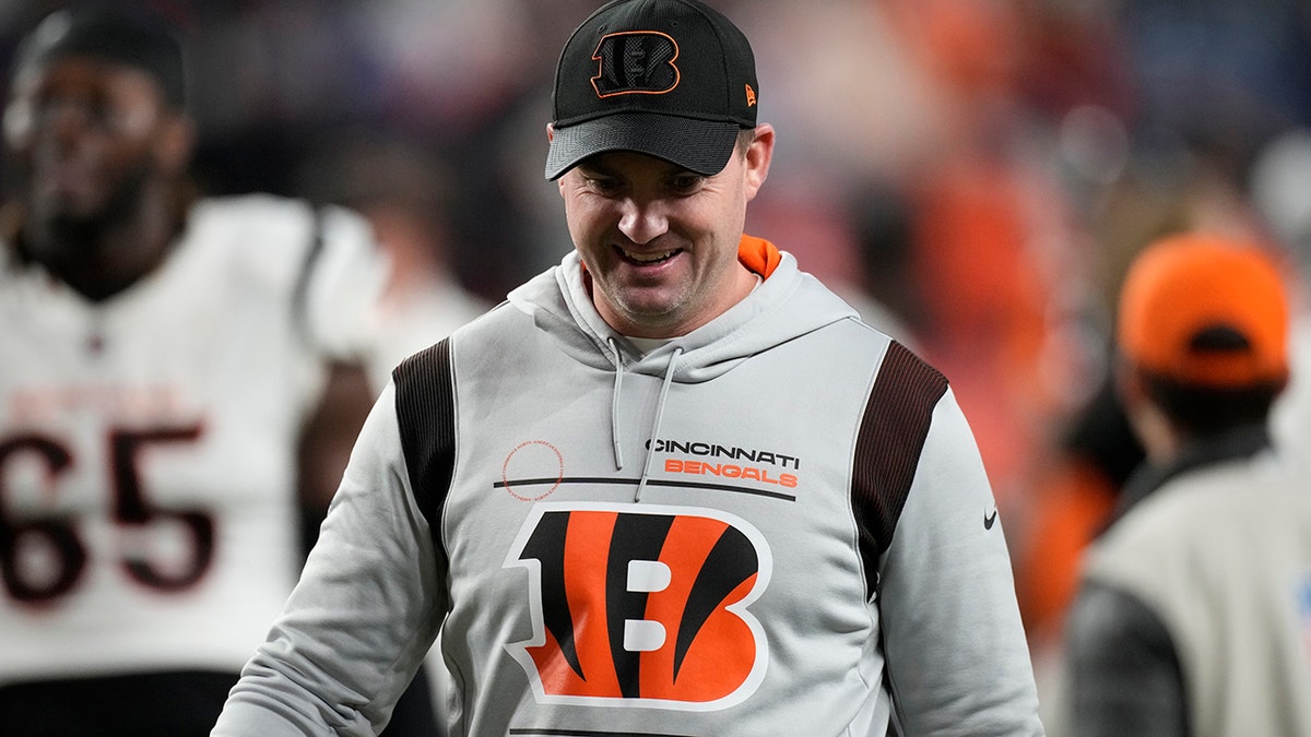 Cincinnati Bengals head coach Zac Taylor leaves the field after an NFL football game against the Denver Broncos, Sunday, Dec. 19, 2021, in Denver. The Bengals won 15-10.