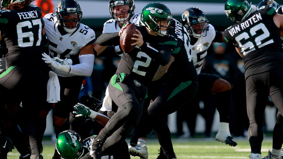 Zach Wilson (2) of the New York Jets scrambles during the first quarter in a game against the Jacksonville Jaguars at MetLife Stadium Dec. 26, 2021, in East Rutherford, N.J.