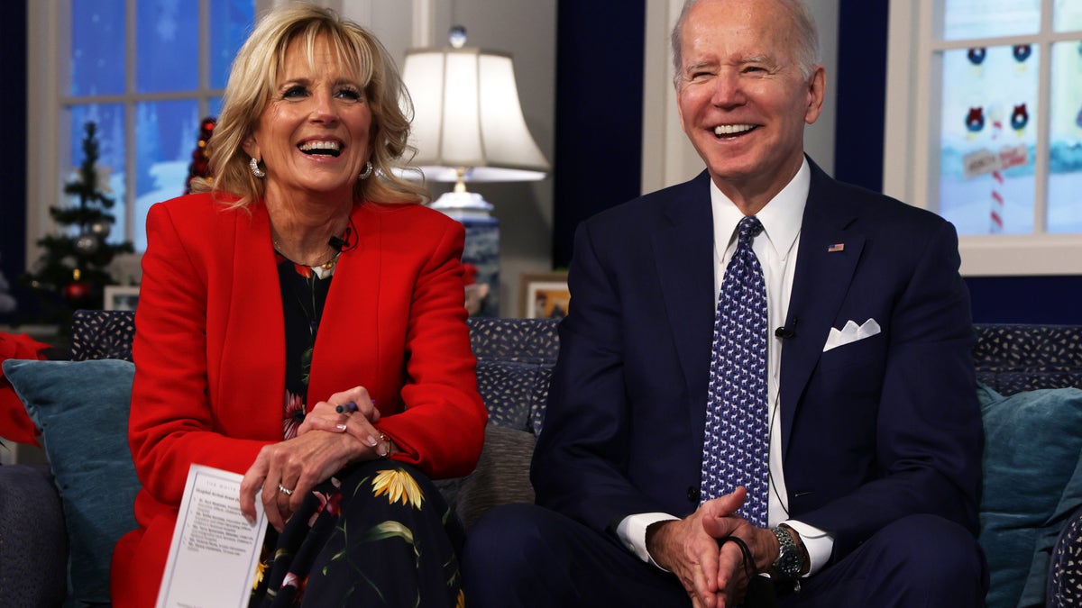 President Joe Biden and first lady Dr. Jill Biden participate in an event to call NORAD and track the path of Santa Claus on Christmas Eve