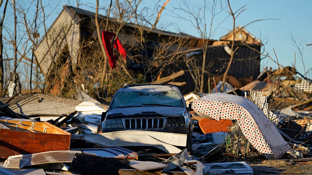 Damaged cars and destroyed homes are seen in the aftermath of tornadoes that tore through the region, in Mayfield, Kentucky, Monday, Dec. 13, 2021. 