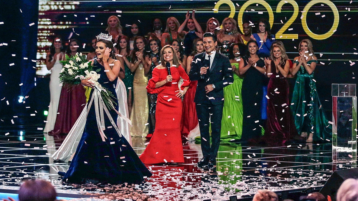 Virginia's Camille Schrier walks the stage after winning the Miss America competition at the Mohegan Sun casino in Uncasville, Connecticut, Dec. 19, 2019. 