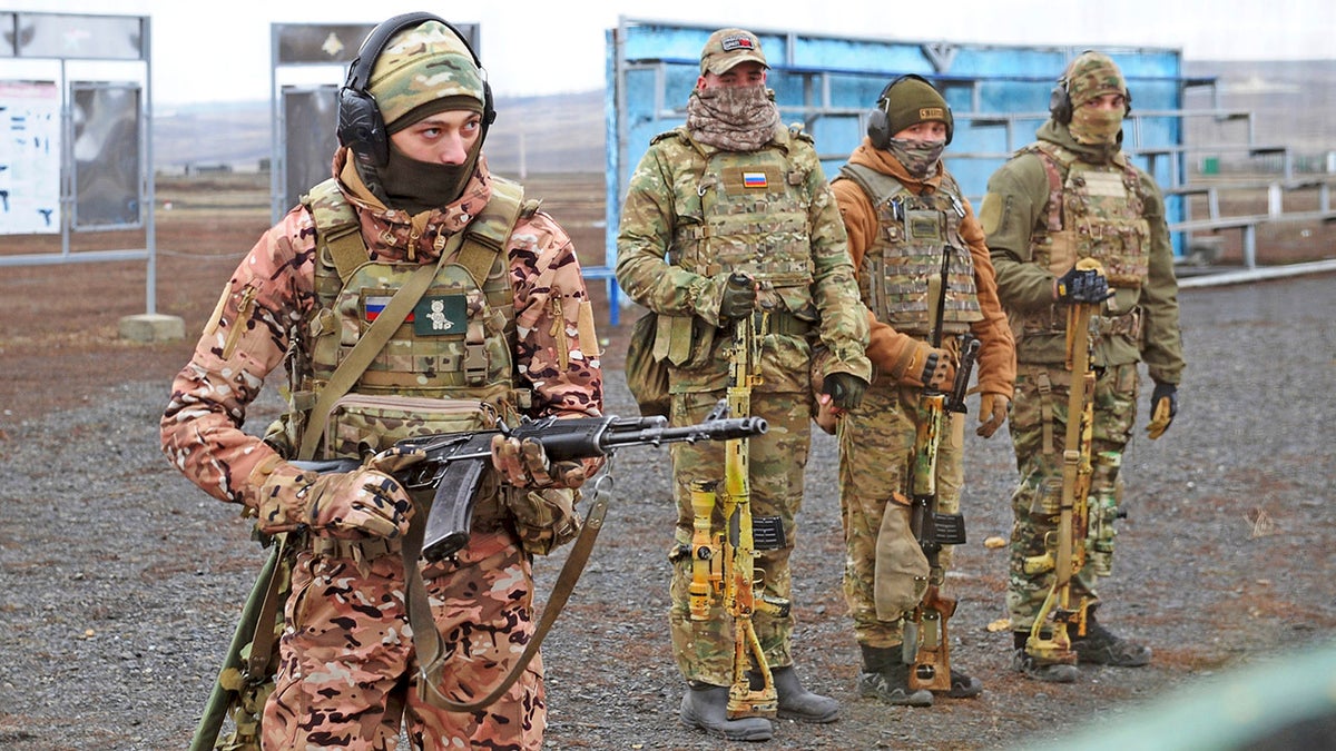 Russian troops take part in drills at the Kadamovskiy firing range in the Rostov region in southern Russia, Tuesday, Dec. 14, 2021.