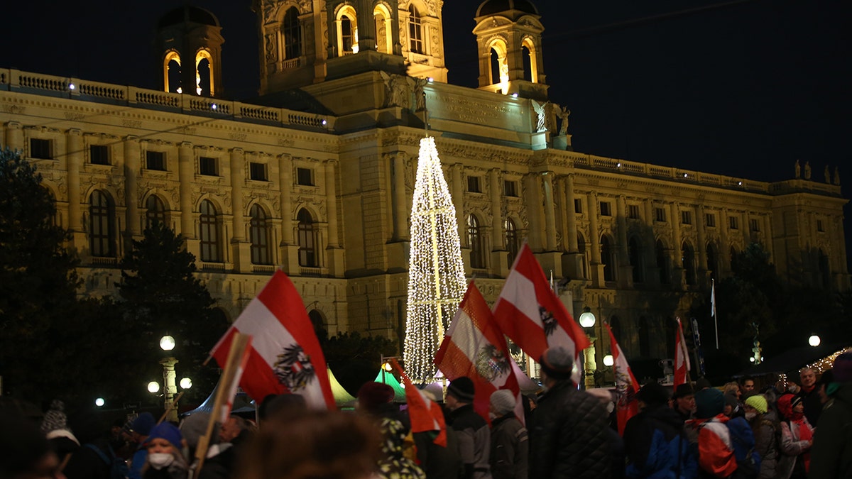 People gather to protest against vaccination requirement and coronavirus measures despite the curfew imposed throughout the country in Vienna, Austria on Dec. 4, 2021.