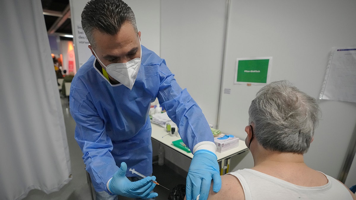 Man receiving COVID vaccine