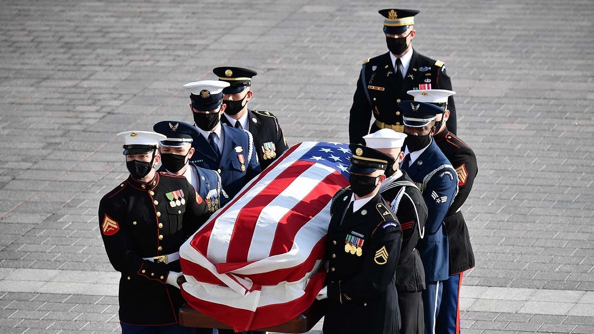 The casket of late Senator Bob Dole arrives to the U.S. Capitol in Washington, D.C., U.S., on Thursday, Dec. 9, 2021. Dole, the World War II veteran who recovered from near-fatal wounds to become the U.S. Senate Republican leader and a three-time presidential candidate, died at 98 on December 5. Photographer: Mandel Ngan/AFP/Bloomberg via Getty Images