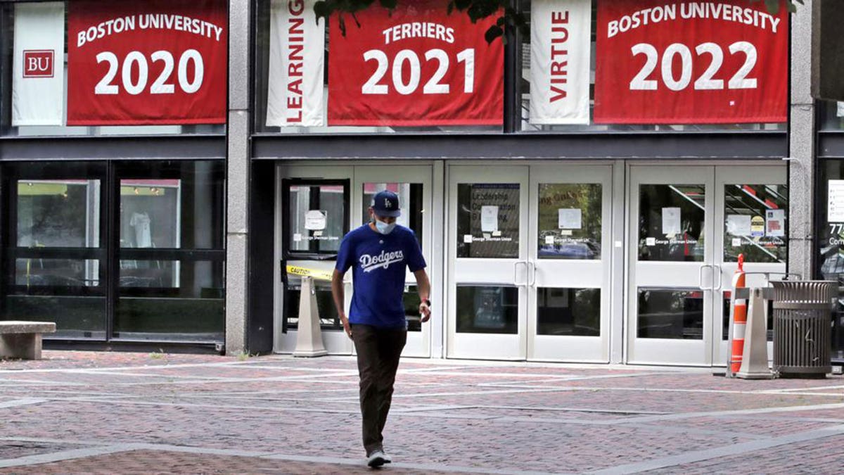 Weston Koenn, a graduate student from Los Angeles, walks through the student-less campus of Boston University on July 23, 2020.