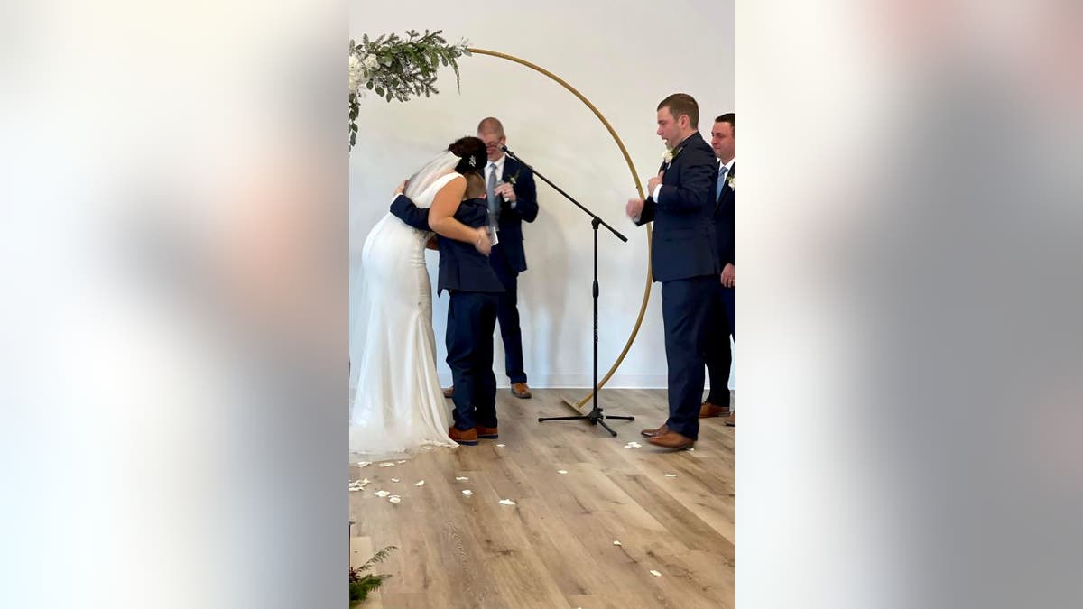 Henry, 9, immediately gave his new stepmother – Vanessa Lynch, 30 – a hug after she delivered heartfelt vows to him on her wedding day.