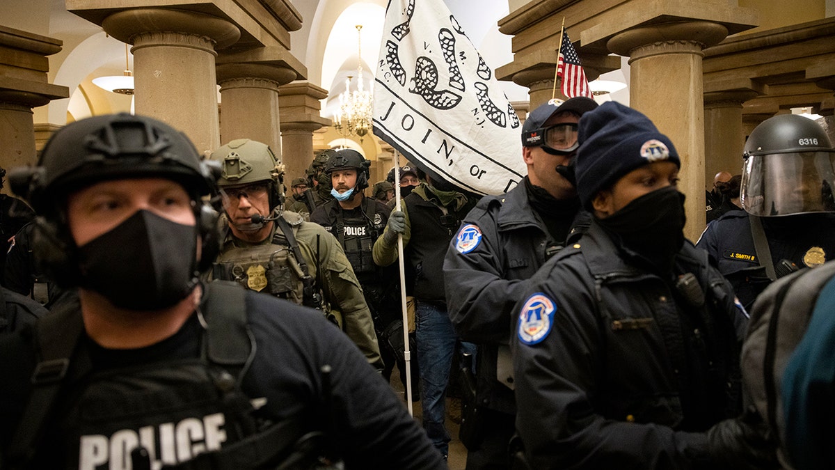 FBI and ATF law enforcement push out supporters of President Trump as they protest inside the U.S. Capitol on Jan. 6, 2021, in Washington, D.C. 