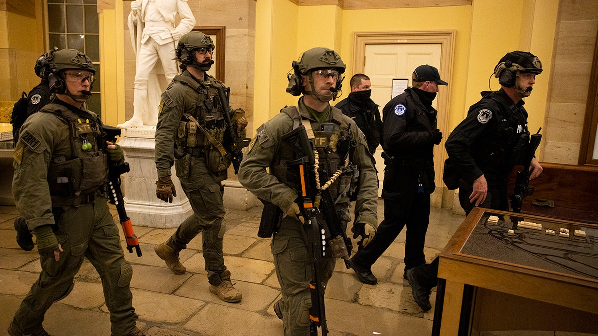 FBI and ATF law enforcement push out supporters of President Trump as they protest inside the U.S. Capitol on Jan. 6, 2021, in Washington, D.C. 