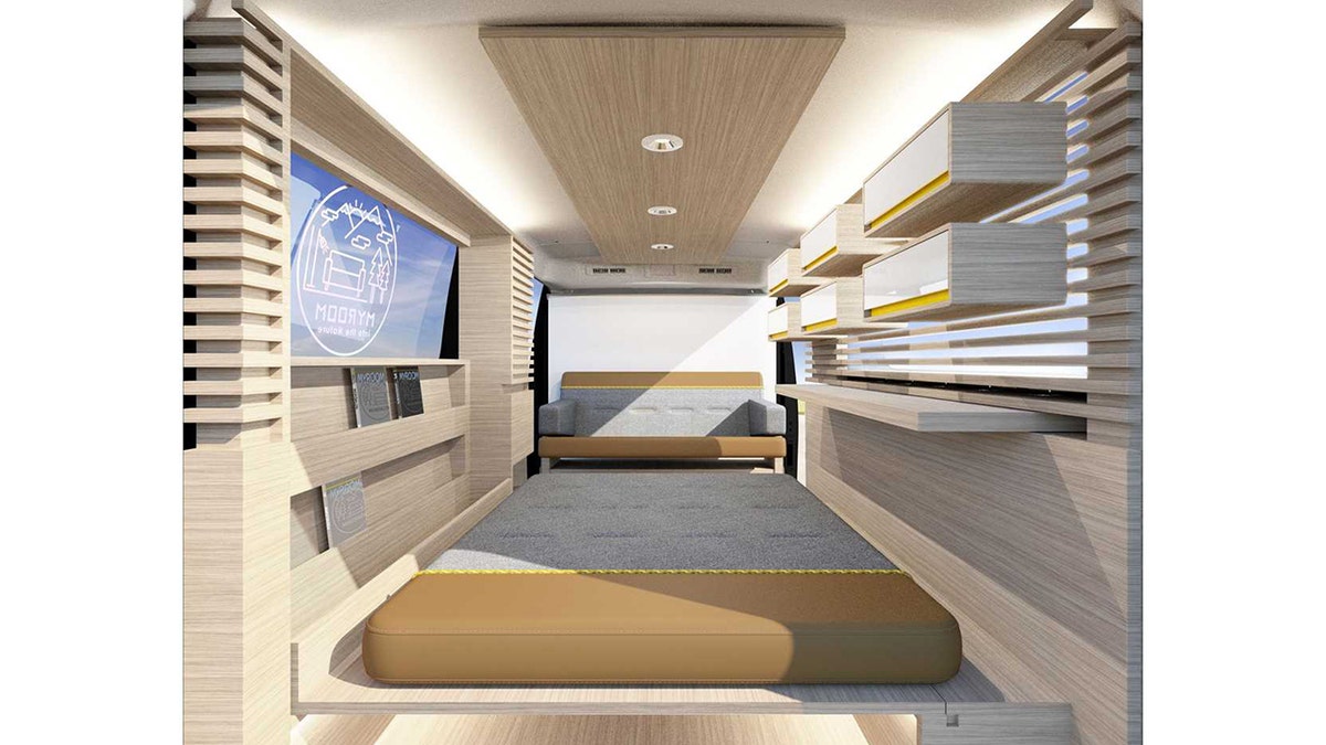 The Nissan Myroom is equipped with a bed, sofa, shelves and drawers.