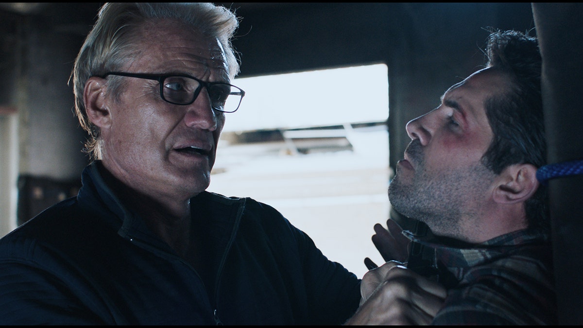 L-R] Dolph Lundgren as Sheaand Scott Adkins as Mike in the action/thriller film, "Castle Falls", a Shout! Studios release.