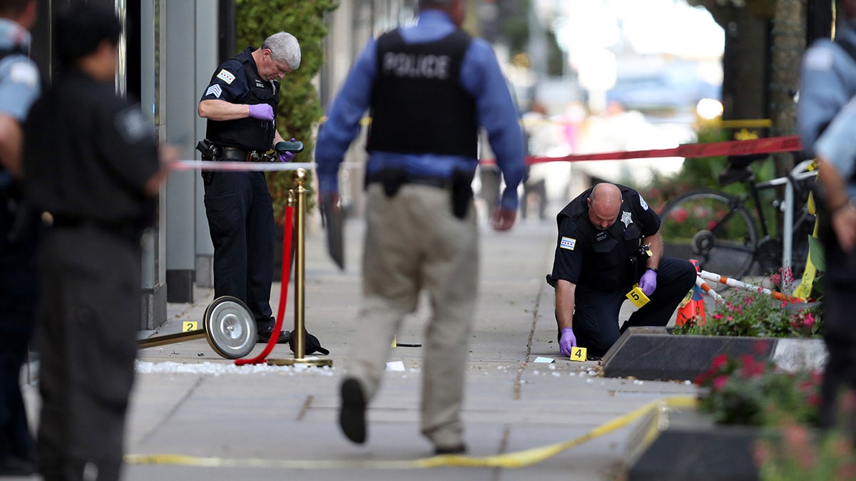 Chicago police investigate the shooting of rapper FBG Duck in the first block of East Oak Street in the Gold Coast neighborhood on Aug. 4, 2020. (Chris Sweda/Chicago Tribune/Tribune News Service via Getty Images)