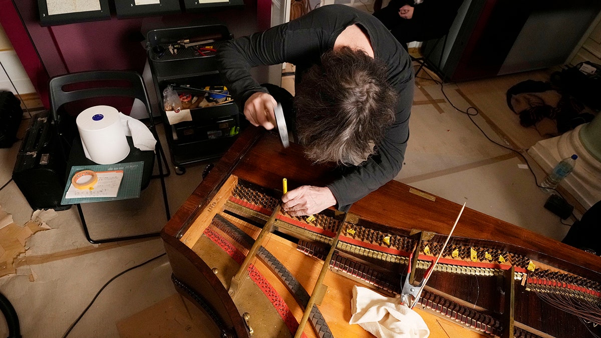Texas-born expert on historic pianos, Paul McNulty, renovates the last piano that Frederic Chopin played and composed on, at the Chopin museum in Warsaw, Poland, on Thursday, Dec. 9, 2021.