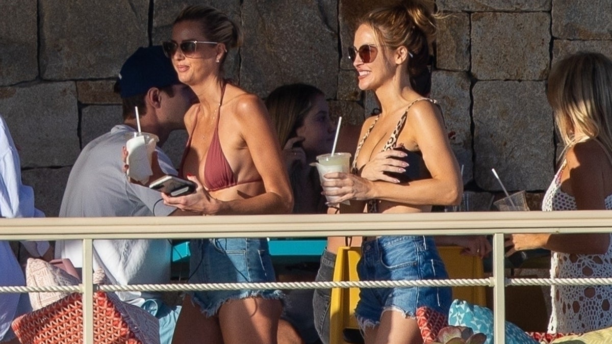 The Netflix co-stars let loose poolside and enjoyed some beverages.