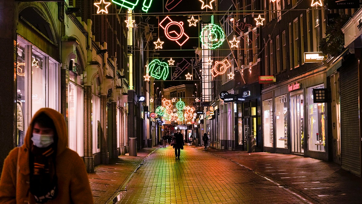 Amsterdam's streets are near-empty at 5 p.m. Monday, Nov. 29, 2021, after the Netherlands' tougher COVID-19 lockdown went into effect. 