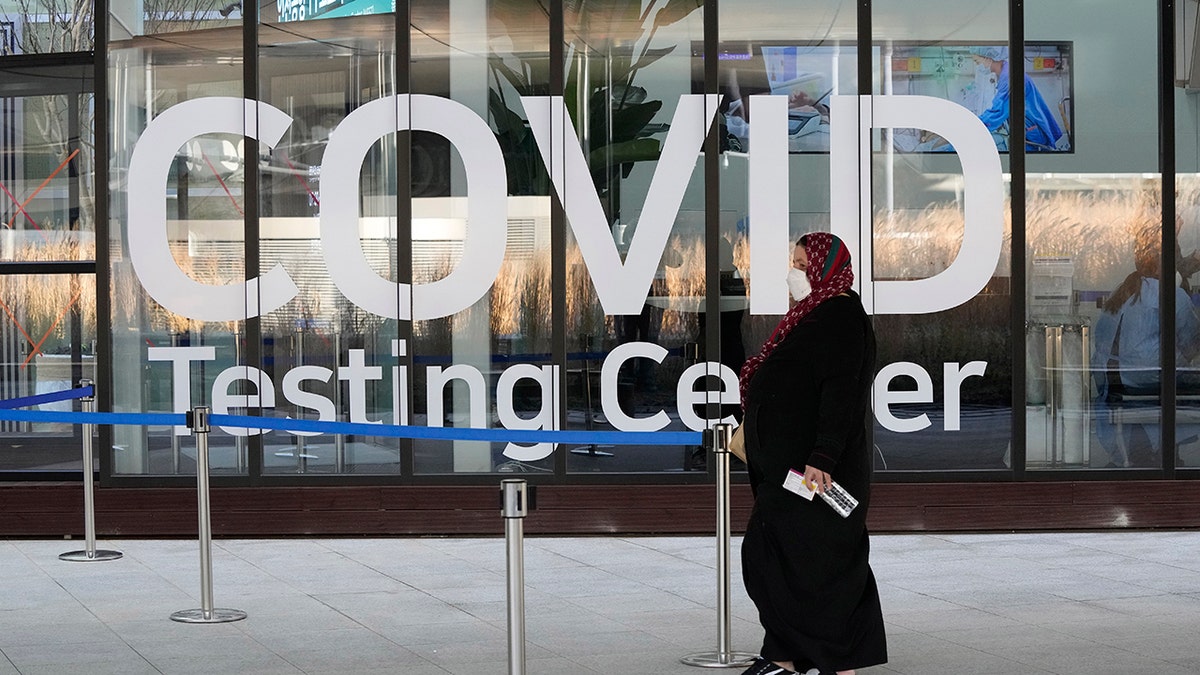 A traveler arrives to enter a COVID-19 testing center at the Incheon International Airport In Incheon, South Korea, Wednesday, Dec. 1, 2021. 