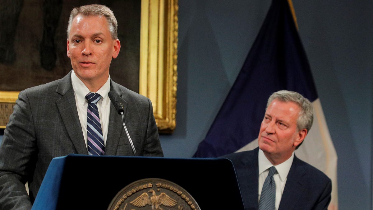 New York City Police Department Chief of Detectives and incoming Commissioner, Dermot Shea speaks as New York City Mayor Bill de Blasio looks on during a news conference. November 4, 2019. REUTERS/Brendan McDermid