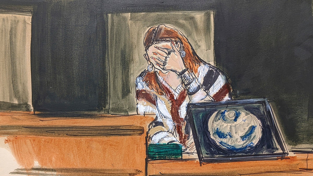 In this courtroom sketch, a witness using the pseudonym "Carolyn" breaks down on the witness stand while testifying about her experiences with Jeffery Epstein, during Ghislaine Maxwell's sex-abuse trial, in New York on Dec. 7, 2021. 