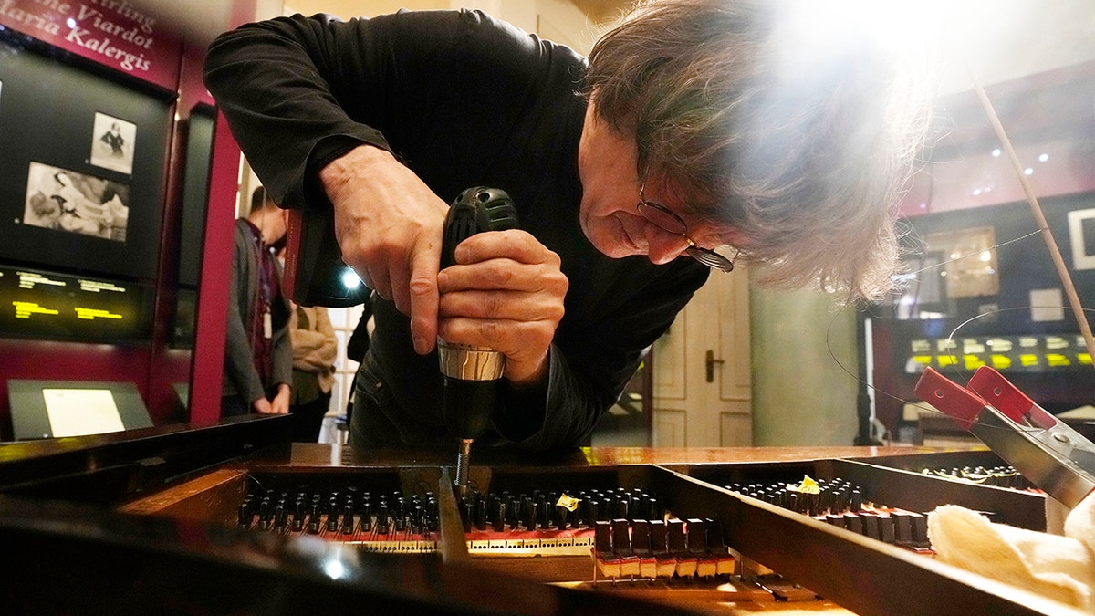 Paul McNulty renovates Chopin's last piano in Warsaw, Poland, on Thursday, Dec. 9, 2021. Chopin, Poland’s best known and beloved classical music composer and pianist, was born in 1810 in Zelazowa Wola, near Warsaw, to a Polish mother and a French father.