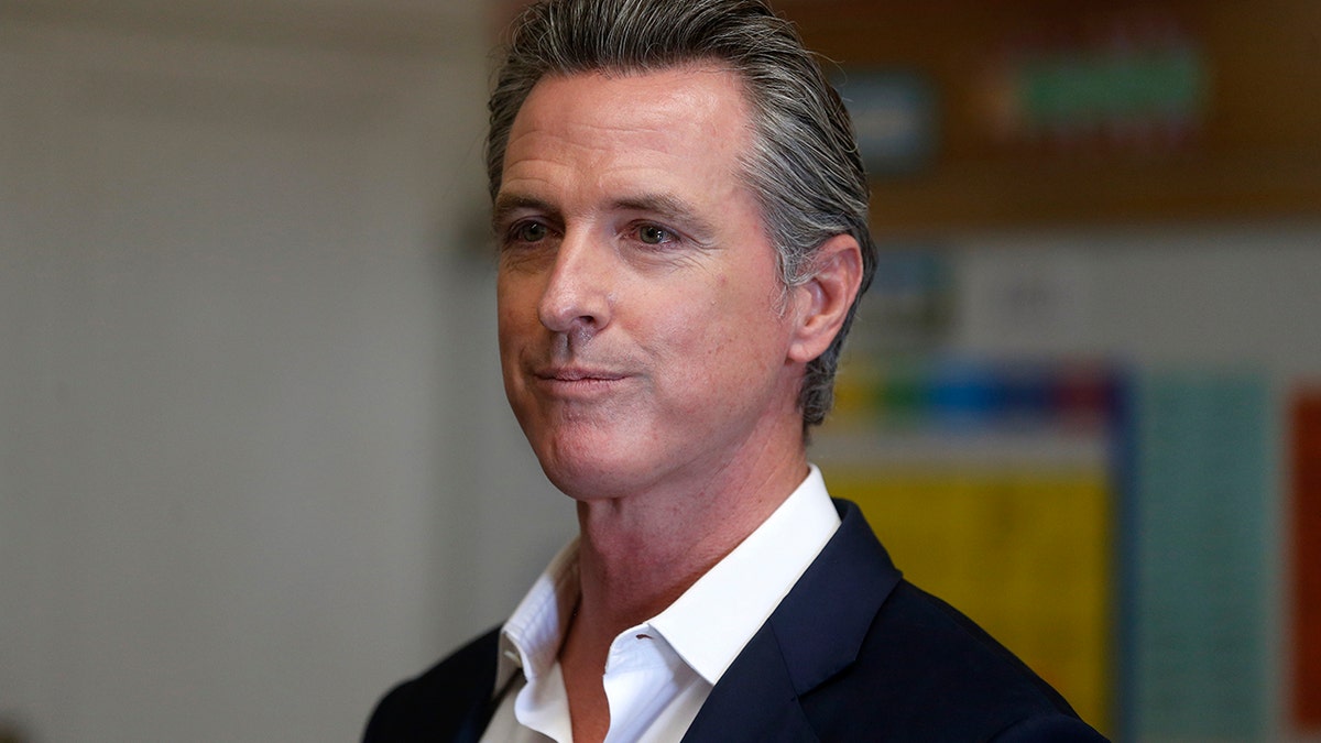 Gov. Gavin Newsom pauses while speaking to the press during a visit to Melrose Leadership Academy in Oakland, Calif., on Wednesday, Sept. 15, 2021.