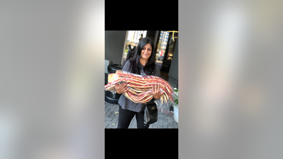 FAMIL co-founder Geeta Bakshi collects bread for Afghan refugees.