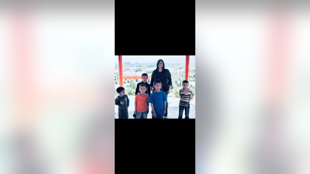 Geeta Bakshi, a former CIA officer, with Afghan children