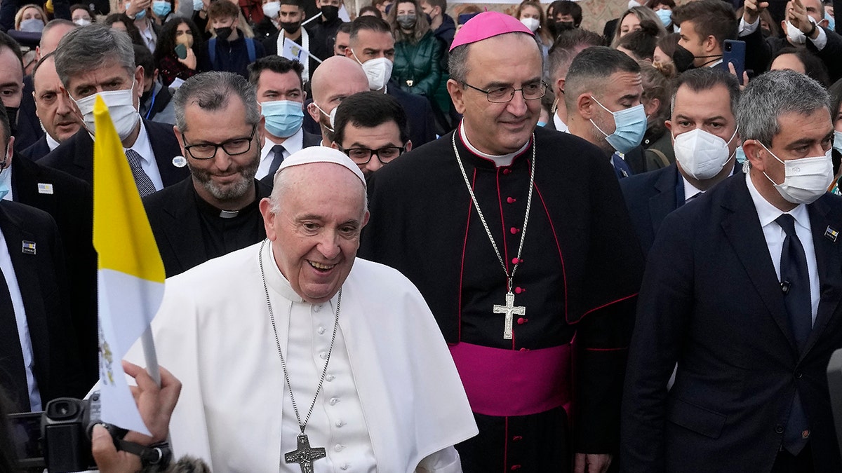Pope Francis arrives for a meeting with young people at the Saint Dionysius School of the Ursuline Sisters in Athens, Greece, Monday, Dec. 6, 2021. 
