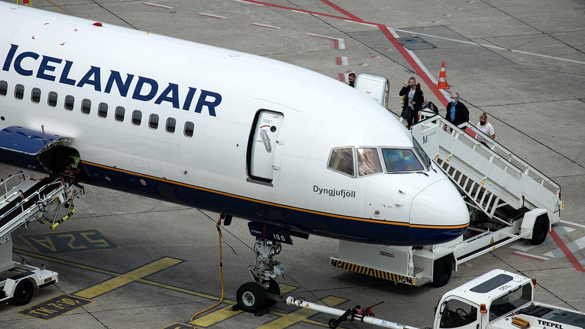 FILE: A passenger on an Icelandair flight said she voluntarily quarantined inside the bathroom of a plane for four hours after learning she had COVID-19. (Photo by Bernd von Jutrczenka/picture alliance via Getty Images)