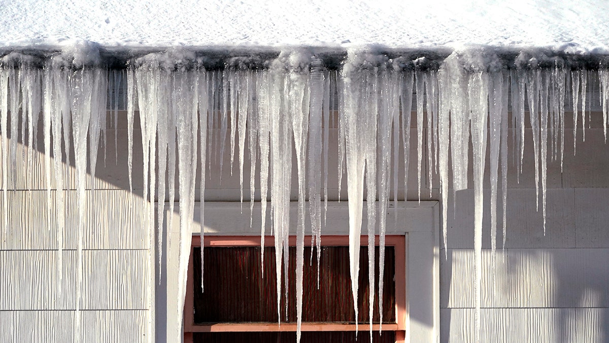 Long icicles hang from a house where nearly a foot of snow fell over the weekend, Monday, Dec. 27, 2021, in Bellingham, Washington. 