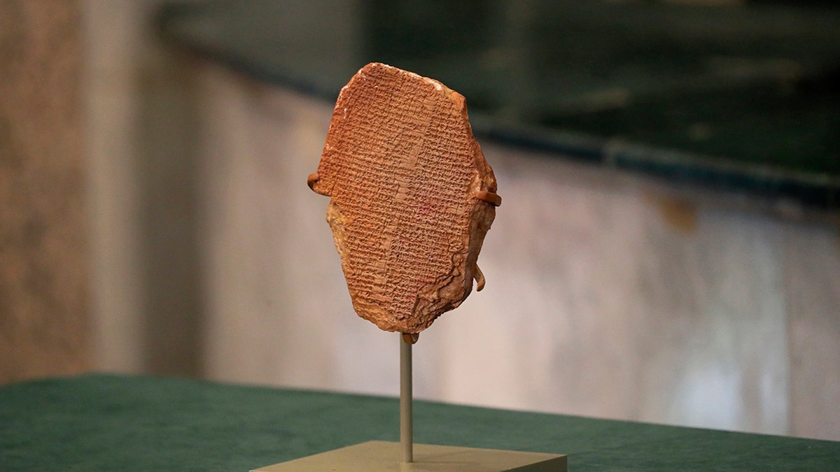 A recovered clay tablet is displayed at the Ministry of Foreign Affairs, Baghdad, Iraq, Tuesday, Dec. 7, 2021. 