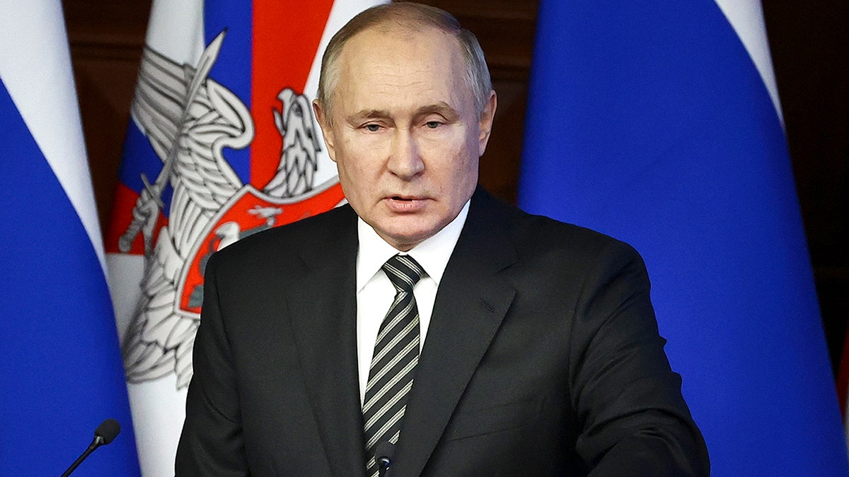Russian President Vladimir Putin addresses an extended meeting of the Russian Defense Ministry Board at the National Defense Control Center in Moscow, Russia, Tuesday, Dec. 21, 2021.