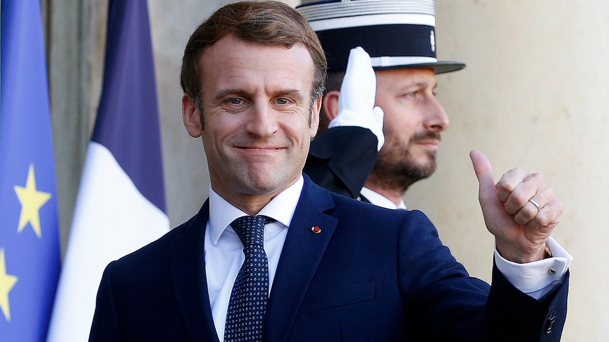 French President Emmanuel Macron thumbs up at the Elysee Presidential Palace on Dec.1, 2021 in Paris, France.  