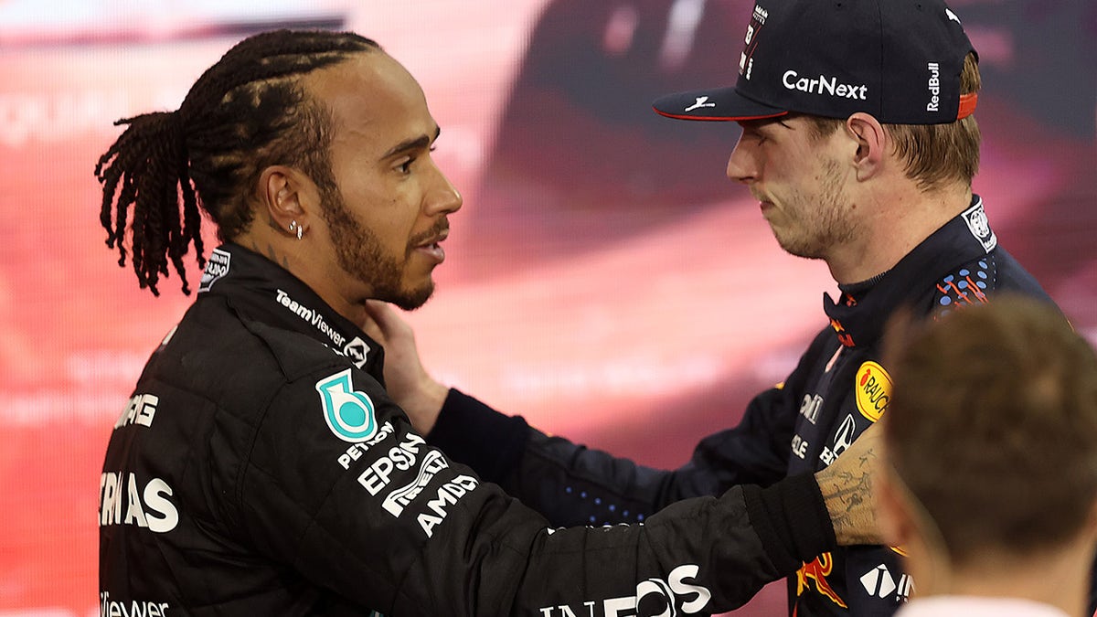 Hamilton (right) congratulates Verstappen after the race.