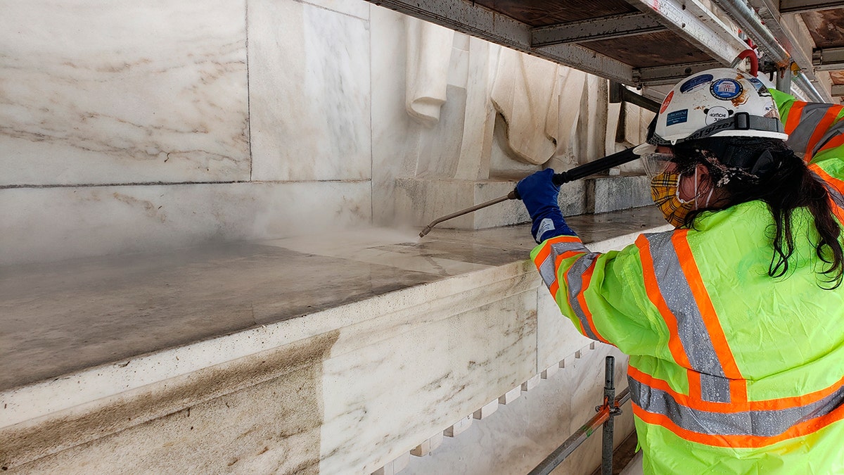 Architectural conservators apply steam to the Jefferson Memorial as part of the GAOA-funded cleaning of the memorial in Washington. 