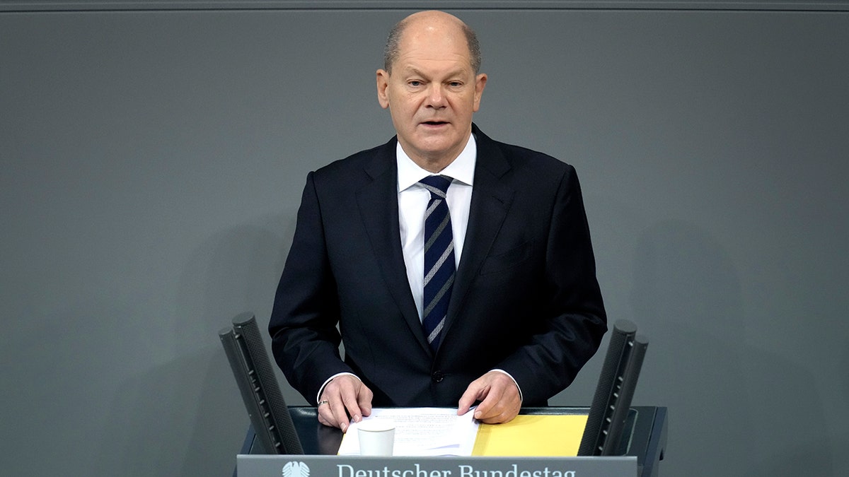 German Chancellor Olaf Scholz delivers a speech during a meeting of the German federal parliament, Bundestag, at the Reichstag building in Berlin, Germany, Wednesday, Dec. 15, 2021. 