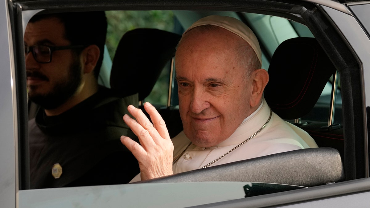 Pope Francis waves as he arrives at the Apostolos Varnavas Orthodox Cathedral in Nicosia, Cyprus, Friday, Dec. 3, 2021. 