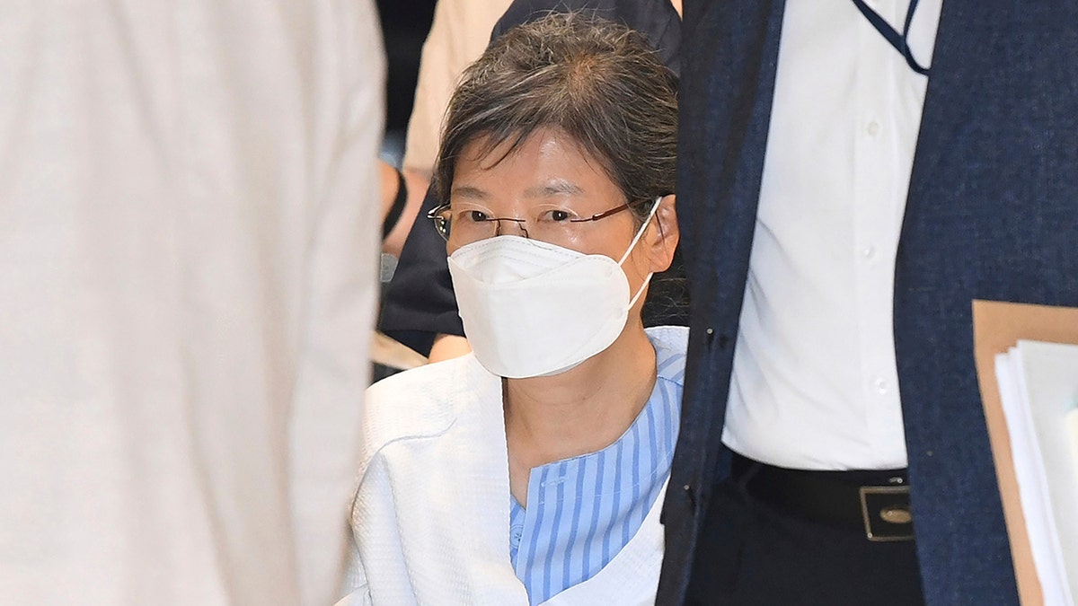 Former South Korean President Park Geun-hye arrives at a hospital in Seoul, South Korea, on July 20, 2021. South Korea on Friday, Dec. 24, 2021 says it will grant a special pardon to Park, who is serving a lengthy prison term for a series of corruption charges. 