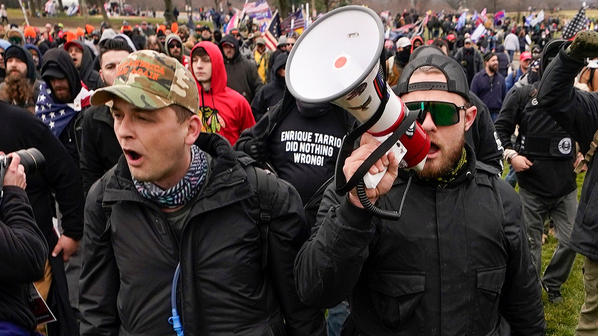 Proud Boys members Zachary Rehl, left, and Ethan Nordean, left, walk toward the U.S. Capitol in Washington, in support of President Donald Trump on Jan. 6, 2021. 