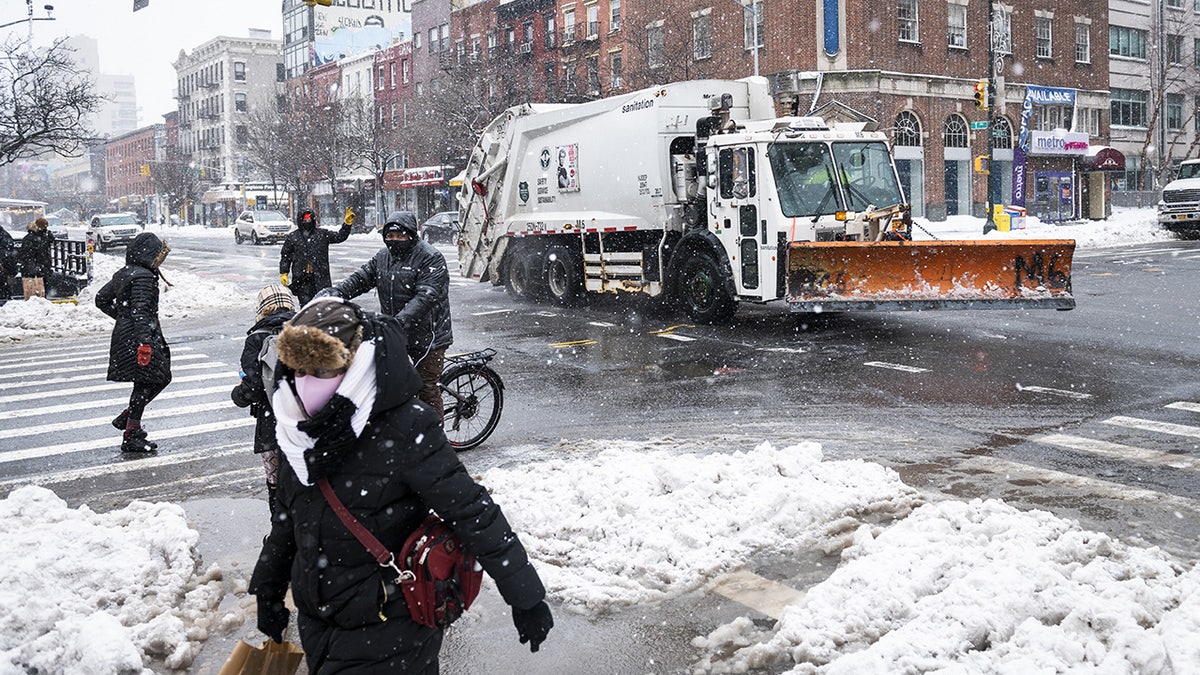FILE 2021: A New York City Department of Sanitation snowplow travels along a street following a winter storm in New York. Photographer: Mark Kauzlarich/Bloomberg via Getty Images