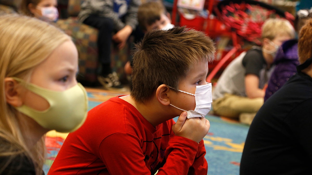 Second-graders listen to a lesson at Paw Paw Elementary School on Thursday, Dec. 2, 2021, in Paw Paw, Michigan. 