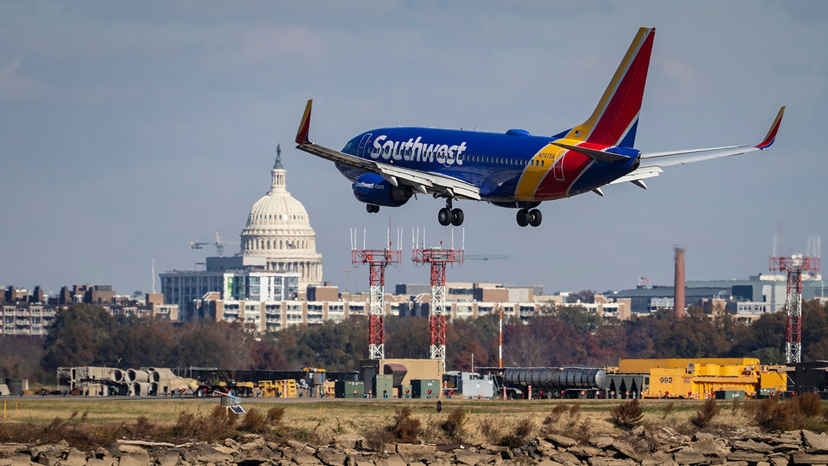 A Southwest Airlines plane lands at Ronald Reagan Washington National Airport Nov. 23, 2021, in Arlington, Virginia.