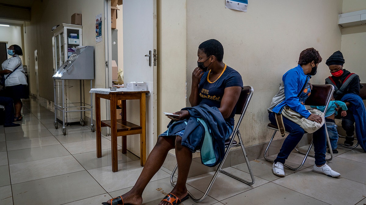 People wait to be vaccinated against COVID-19 at the Hillbrow Clinic in Johannesburg, South Africa, Monday Dec. 6, 2021.