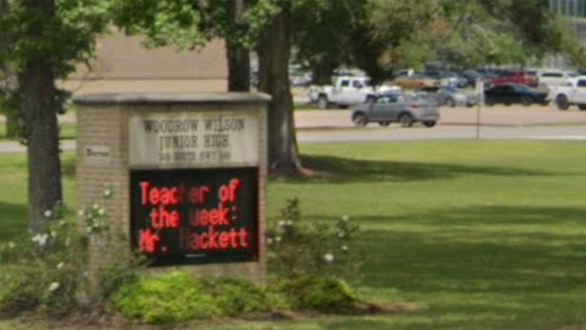 The students were reportedly leaving Woodrow Wilson Junior High when someone pointed a gun at the school bus.