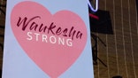 'WAUKESHA STRONG' sign hangs in the windows of many small businesses in Waukesha