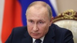 Russian President Vladimir Putin holds a video conference to address participants in a congress of the United Russia party marking the 20th anniversary of the party founding, in Moscow, Russia, Saturday, Dec. 4, 2021. (Mikhail Metzel, Sputnik, Kremlin Pool Photo via AP)