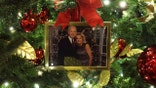 An ornament of a portrait of U.S. President Joe Biden and first lady Jill Biden is hung on a Christmas Tree in the State Dining Room of the White House during a press preview of the holiday decorations November 29, 2021 in Washington, DC.